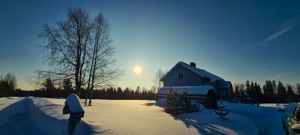 A photo showing the low sun in the winter sky with long projecting shadows.